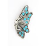 A 925 silver and marcasite brooch set with turquoise, 7 x 3cm.