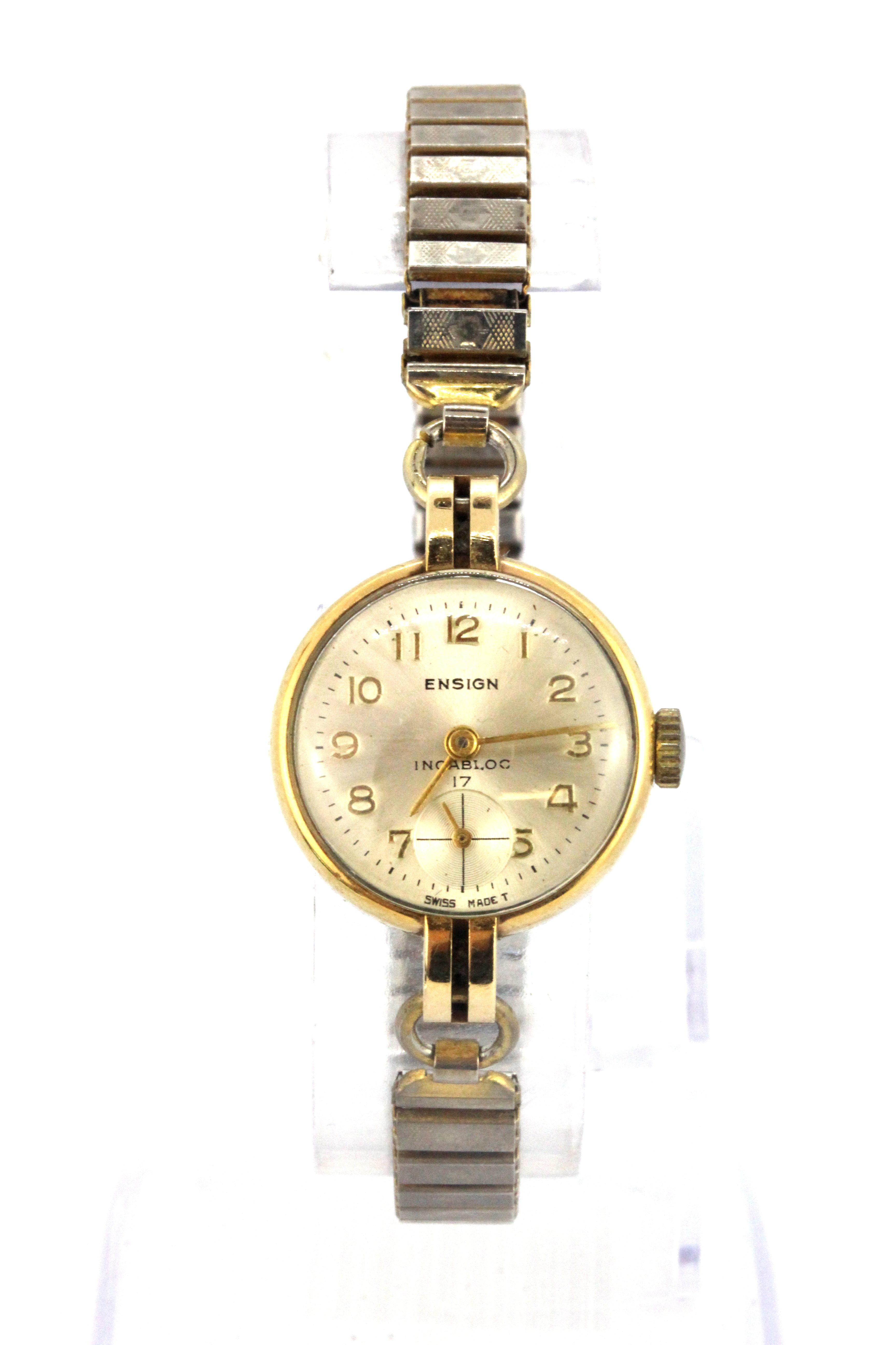 A 9ct yellow gold wrist watch on a stainless steel expandable strap.