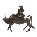 A 19th / early 20th century Chinese bronze censer of a boy riding a water buffalo, L. 20cm H. 16.