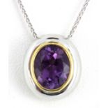 A matching 18ct white gold (stamped 750) pendant and chain set with oval cut amethyst, L. 1.5cm.