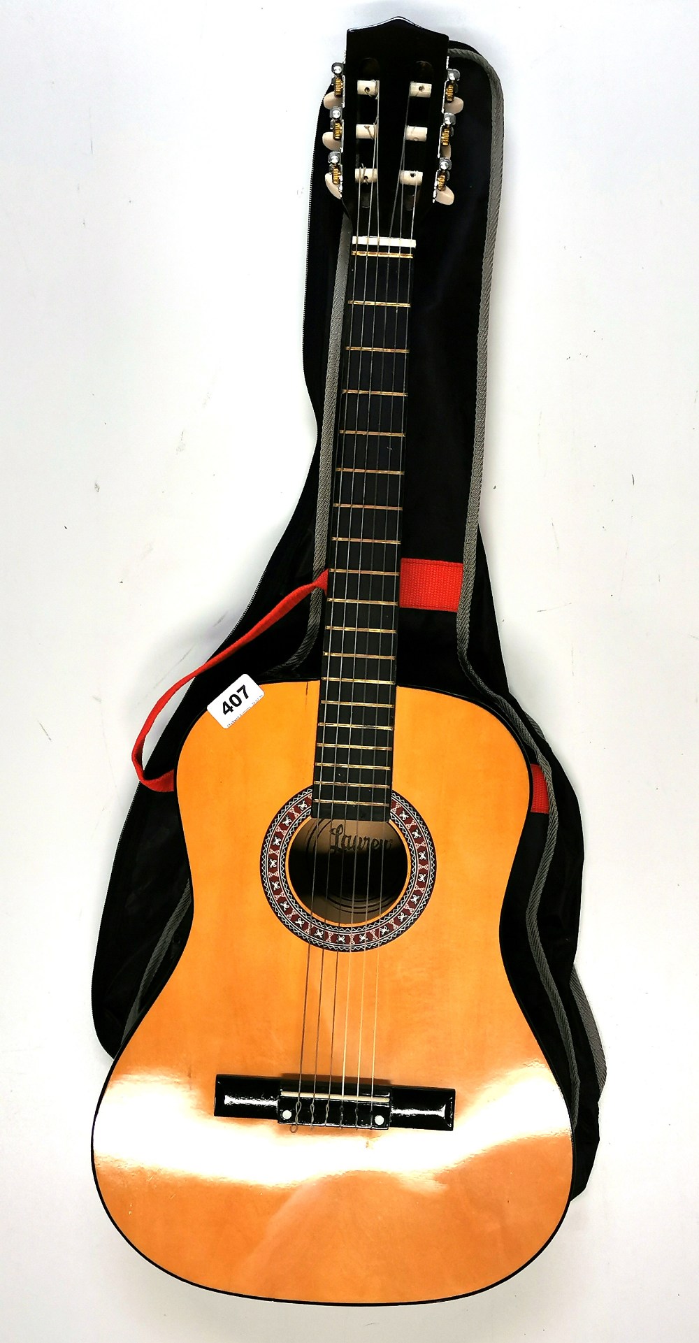 A Lauren half size acoustic guitar.