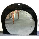 An Art Deco mirror with black glass backing, W. 88cm, H. 85cm.