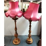 Two turned wood standard lamps and one other, H. 170cm.
