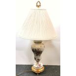 An ormolu mounted porcelain table lamp and shade, H. 75cm.