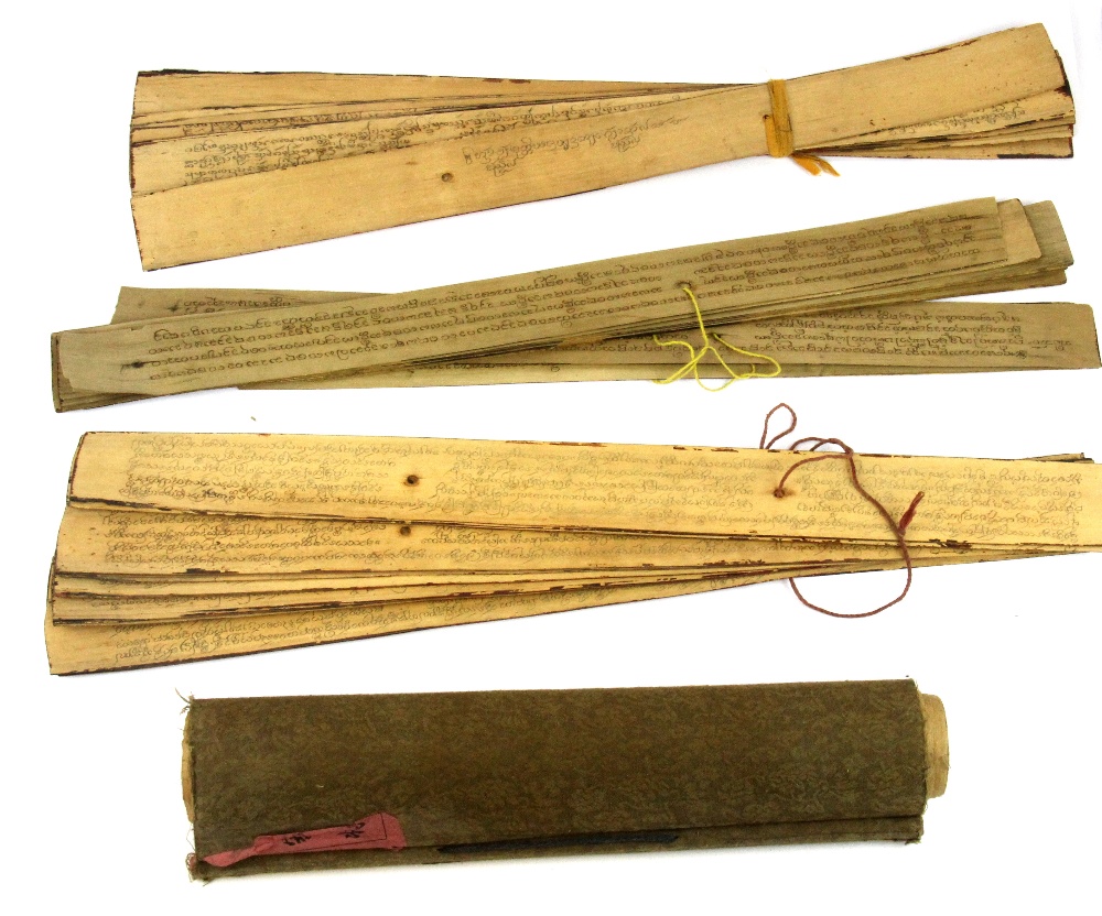 Two Mongolian Buddhist texts inked on reeds with a Chinese scroll.