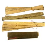 Two Mongolian Buddhist texts inked on reeds with a Chinese scroll.