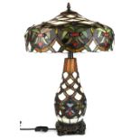 A superb Tiffany style table lamp with illuminated body, H. 58cm.