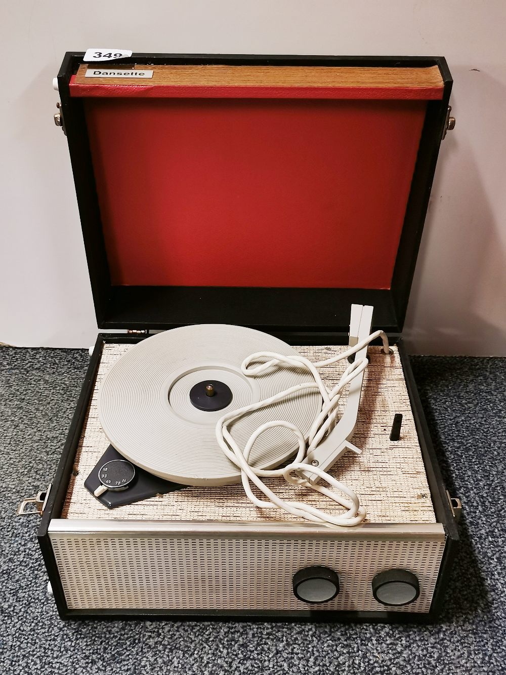 A vintage Dansette portable record player, 32 x 27 x 17cm.