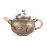 A Chinese pewter covered terracotta teapot with jade spout and handle, L. 18cm.