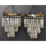 A pair of three tier crystal chandelier light fittings, H. 42cm.