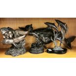 Four bronze and cold cast dolphin figures, tallest 26cm.