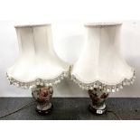 Two pairs of porcelain table lamps and shades and a figural table lamp and shade, H. 60cm.