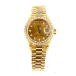 A boxed 18ct yellow gold Rolex Oyster Perpetual lady's wrist watch with original diamond set bezel