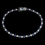 A 925 silver line bracelet set with blue and white stones, L. 19cm.