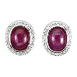 A pair of 925 silver stud earrings set with cabochon cut rubies, L. 1.3cm.
