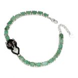 A 925 silver bracelet set with emeralds, with a leopard shaped clasp set wit black spinels and