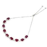 A 925 silver adjustable bracelet set with oval cut rubies and white stones.