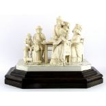 A rare mid 19th Century European carved ivory figure group on an ivory and wood base, overall H.