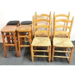 Four vintage stools and four rush seated dining chairs.