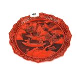 A Chinese cinnabar type plate, Dia. 24cm.