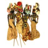 Four vintage Balinese carved wooden puppets, H. 54cm.