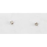 A pair of 950 platinum diamond set stud earrings, approx. 0.15ct overall.