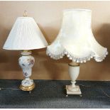 An alabaster table lamp and silk shade, H. 76cm together with an ormolu mounted porcelain table lamp
