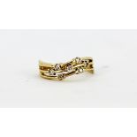 An 18ct yellow gold wave ring set with brilliant cut diamonds, (O).