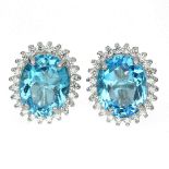 A pair of 925 silver cluster earrings set with large blue topaz surrounded by white stones, L. 1.
