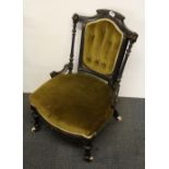 A mid 19th Century upholstered nursing chair, H. 73cm.