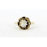 A 9ct yellow gold ring set with a round cut smokey quartz, (P.5).