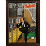 An amusing cocktail mirror, 51 x 65cm.