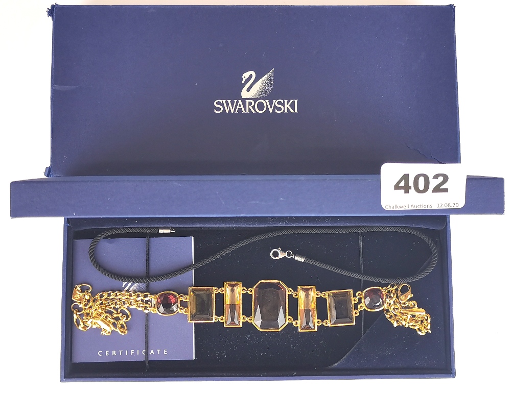 A boxed Swarovski crystal necklace.
