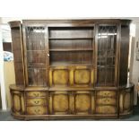A large mahogany veneered breakfront bureau bookcase, W. 290cm, H. 210cm.