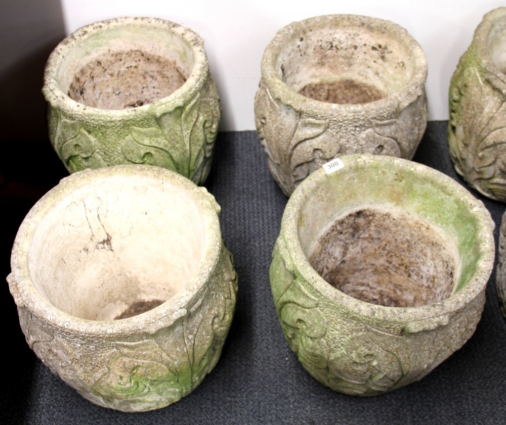 A set of four vintage Art Nouveau design concrete garden planters, H. 41cm.