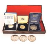 A 1923 silver Liberty USA dollar, a silver proof £1 coin and other coins.