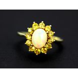 A 925 silver gilt cluster ring set with cabochon cut opal and yellow topaz, (T).