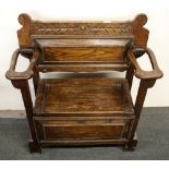 A carved oak hall stand, W. 82cm.