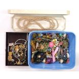 A box of mixed costume jewellery.