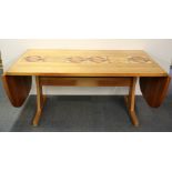 A 1970's heavy quality Scandinavian teak dining table inset with ceramic tiles, extends from 162 -