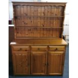 A vintage pine dresser, W. 133cm.