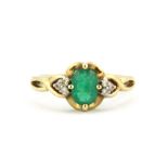 A 9ct yellow gold emerald and diamond set ring, (N.5).