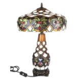 A superb Tiffany style table lamp with illuminated body, H. 58cm.