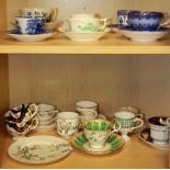 A collection of early English porcelain cups and saucers and a plate.