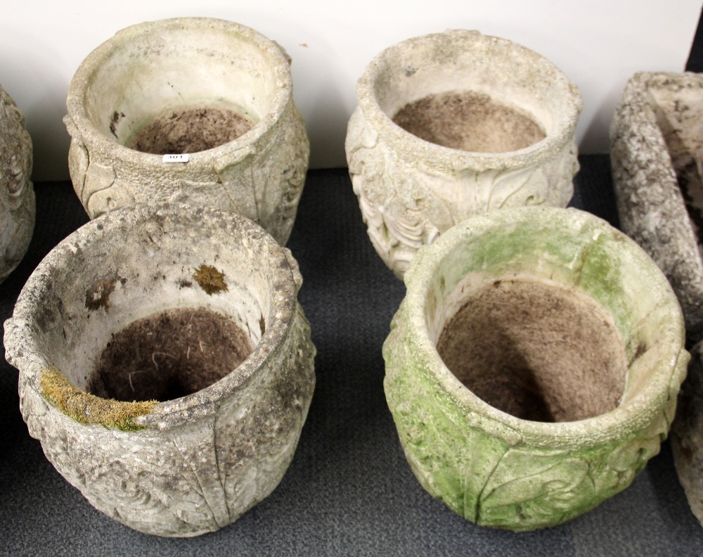 A set of four vintage Art Nouveau design concrete garden planters, H. 41cm.