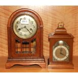 An oak mantle clock and a further mantle clock, both understood to be in W/O, oak clock H. 31cm.