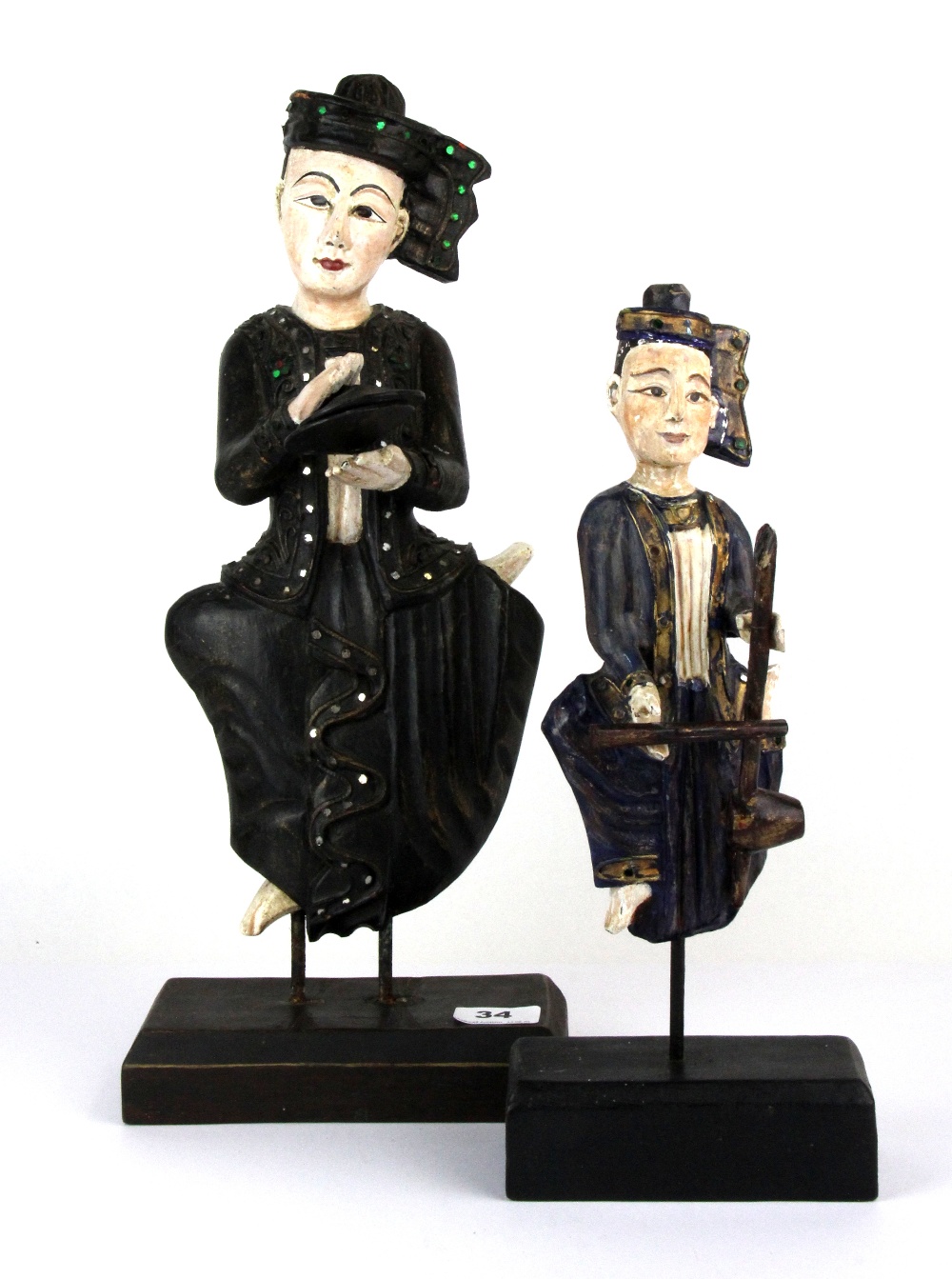 Two hand painted carved wooden Siamese figures of musicians, tallest 46cm.