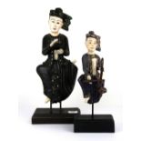 Two hand painted carved wooden Siamese figures of musicians, tallest 46cm.