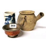 A Tibetan white metal mounted wooden yak butter tea bowl with a Chinese terracotta teapot and