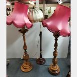 Two turned wood standard lamps and one other, H. 170cm.